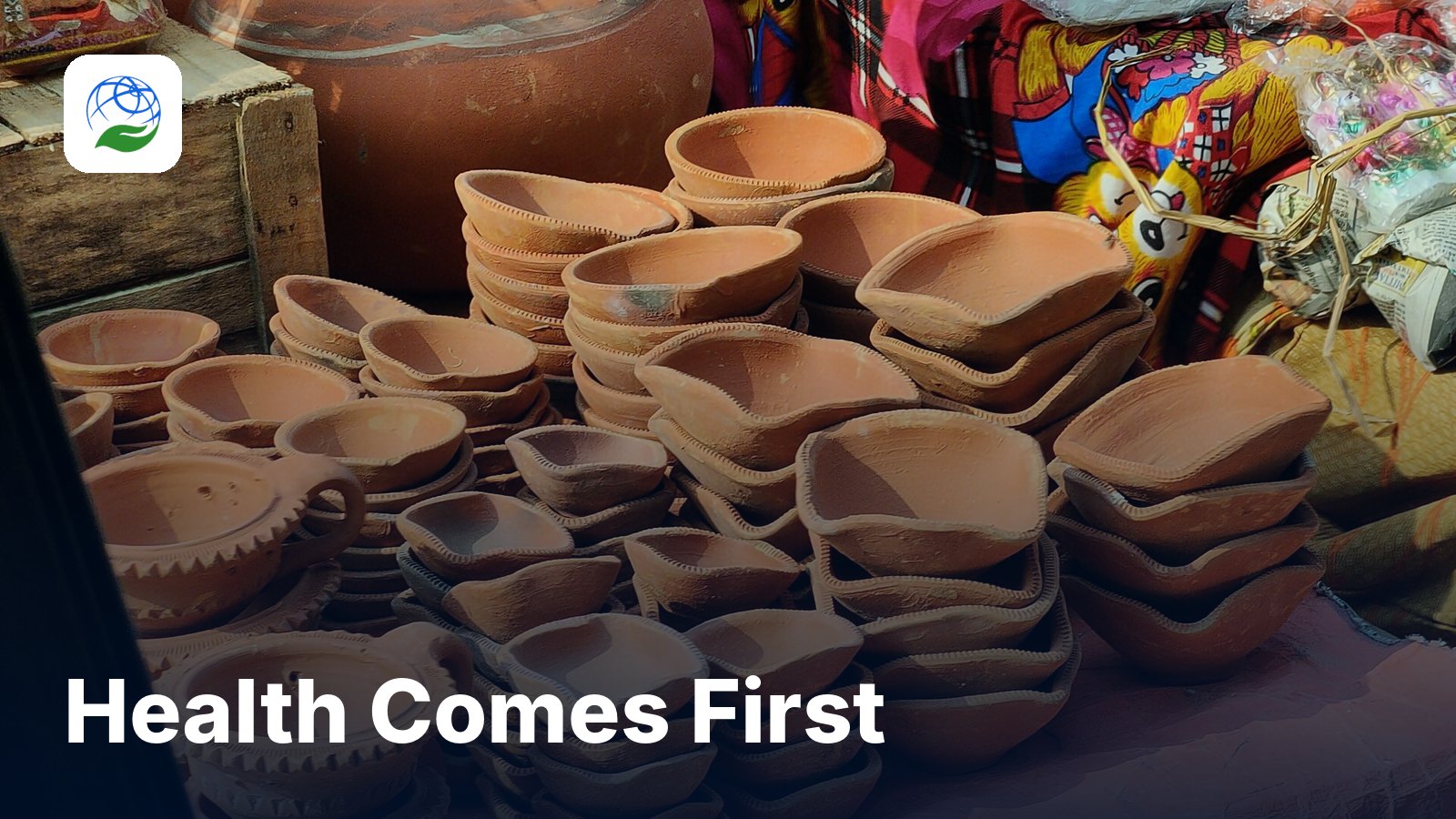 Stacks of clay diyas at a festival market, with the title Health Comes First